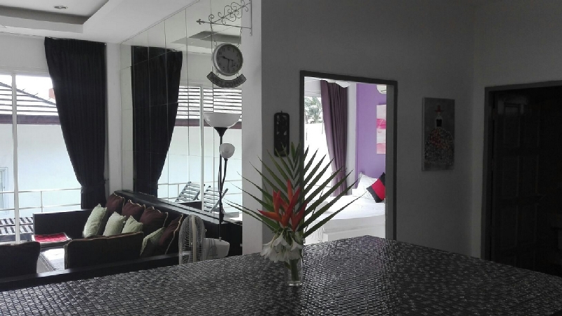 view from the kitchen bar on the large corner sofa in the living room overlooking the terrace and the 'Sacré Coeur' bedroom overlooking the pool